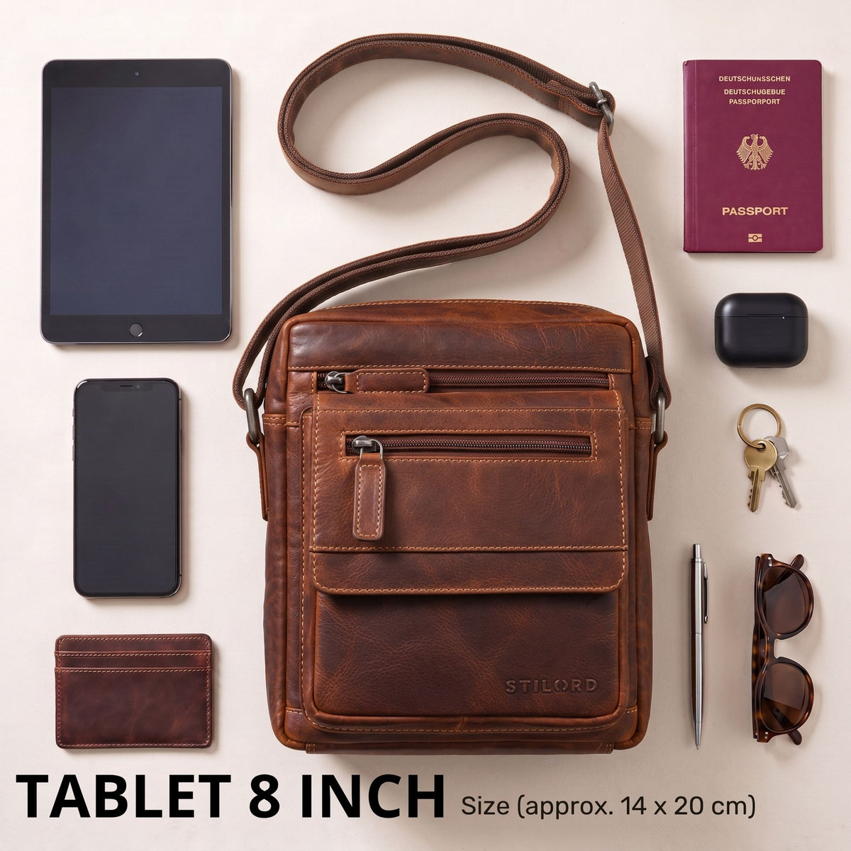 Malá plochá pánska crossbody z hovädzej kože salerno hnedá, predný pohľad s vreckami na zips, 8" tablet a razba STILORD