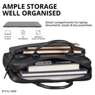 schwarze Leder-Business-Tasche geöffnet mit gepolstertem Laptopfach, mehreren Fächern, Büchern, Powerbank und sichtbarem STILORD-Logo
